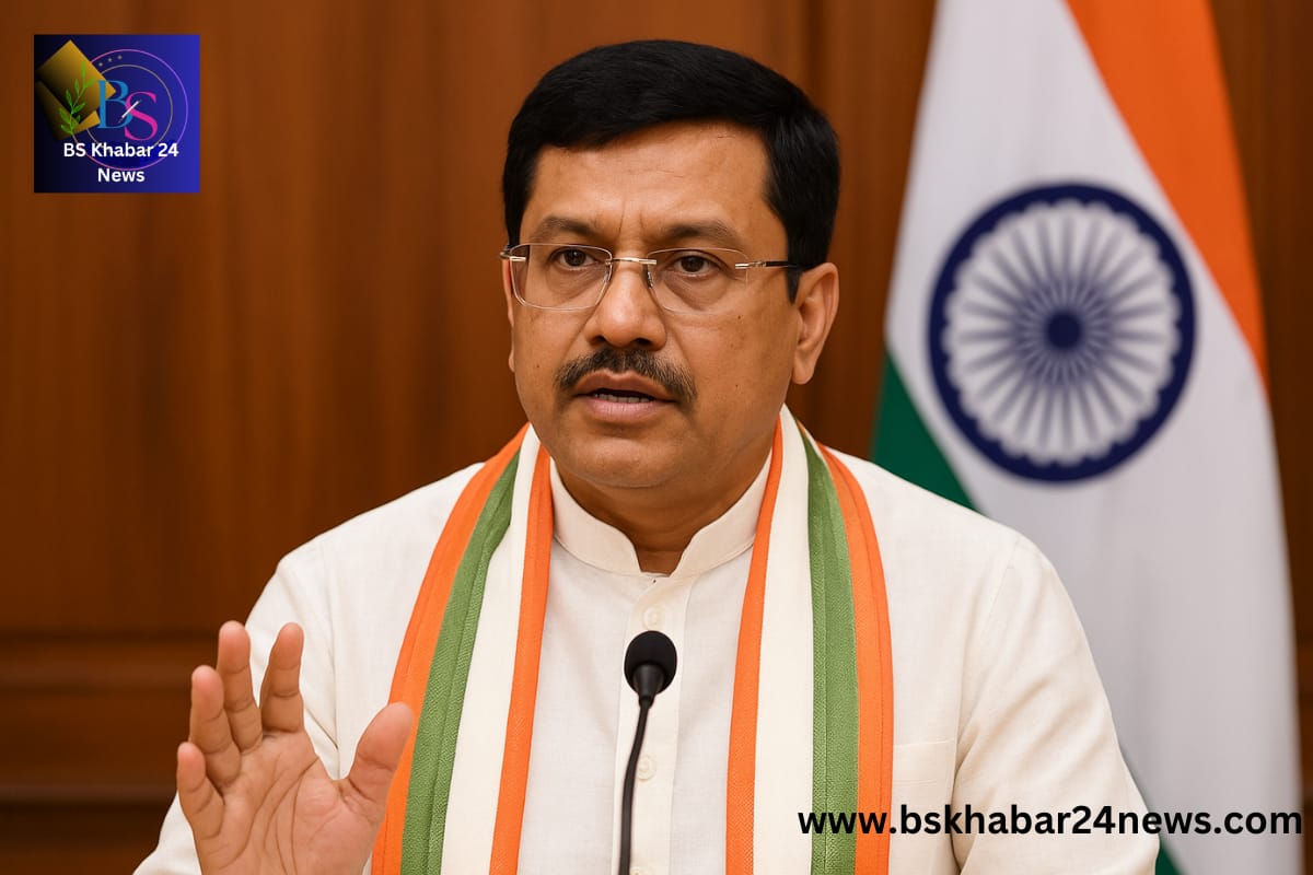 Tripura Chief Minister addressing a press conference, wearing a white kurta with a tricolor shawl, standing in front of the Indian flag while speaking about state development plans and bamboo production initiatives, Tripura's delicious bamboo.
